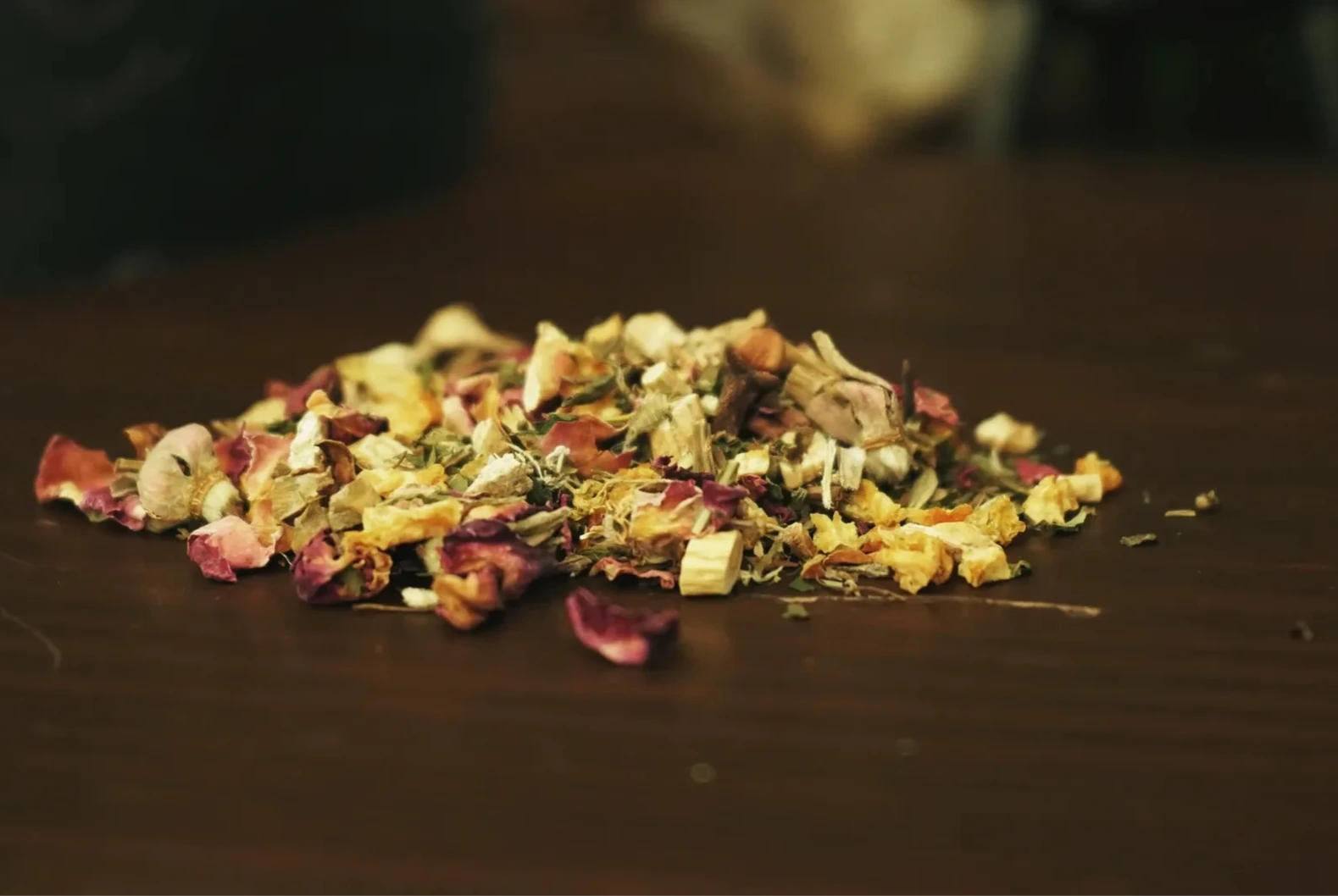 medicinal herbs sit on a table after being handcrafted from a medical astrologer and clinical herbalist.